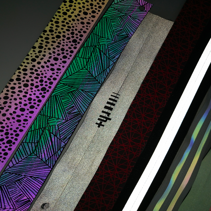 Colorful reflective zipper with lettering in the middle